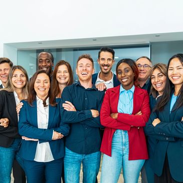 Diverse group of happy professionals standing together.