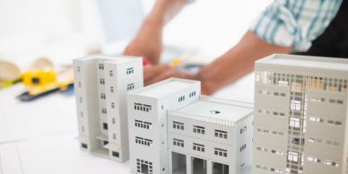 Architect working with building models.