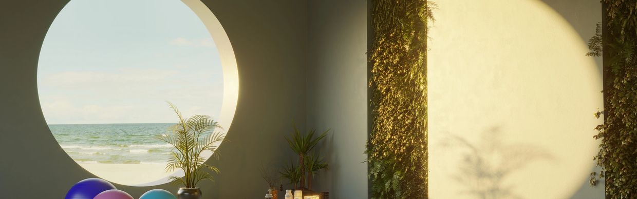 Room with a circular window overlooking the ocean and plants indoors.