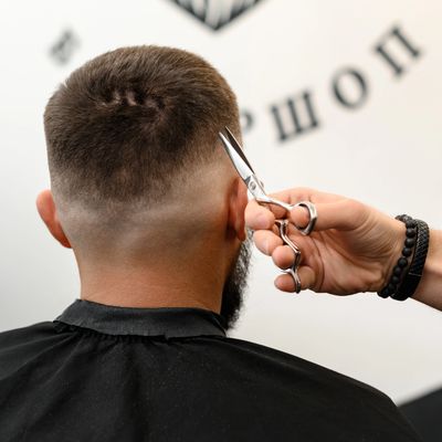 Bold fade haircut and beard grooming at Sharp & Faded, Oakland Park