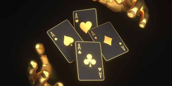 Golden hands holding glowing aces in a dark setting.