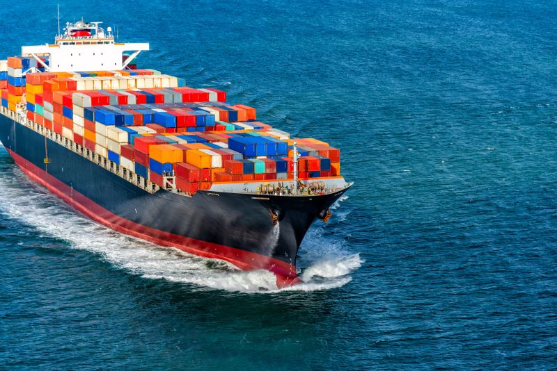 A fully loaded container ship heading to sea through the San Francisco Bay.