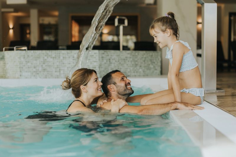 Family enjoy in the indoor swimming pool
