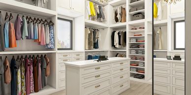 Spacious modern walk-in closet with organized shelves and hanging clothes.