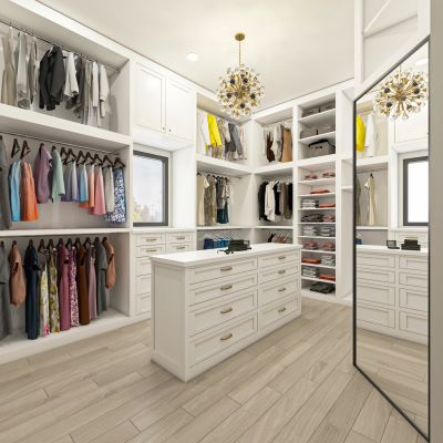 Spacious, modern walk-in closet with white cabinetry and a chandelier.