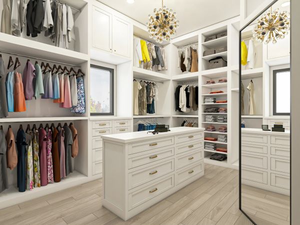 Spacious modern walk-in closet with white cabinetry and gold accents.