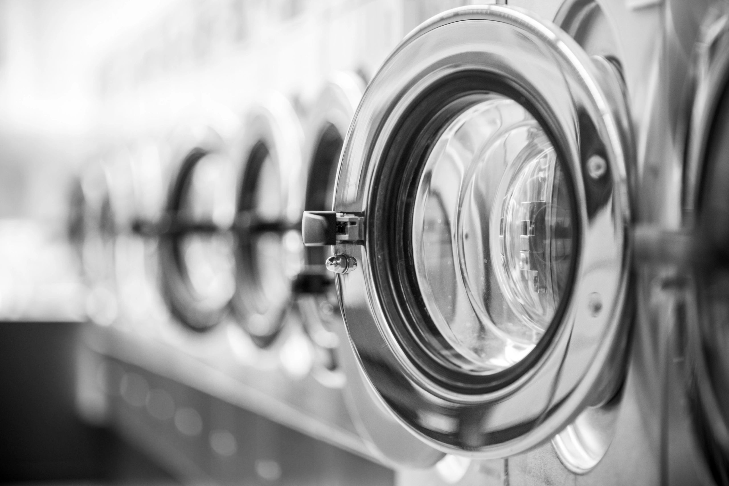 Industrial laundry washer cleaning commercial linen, Greater Manchester
