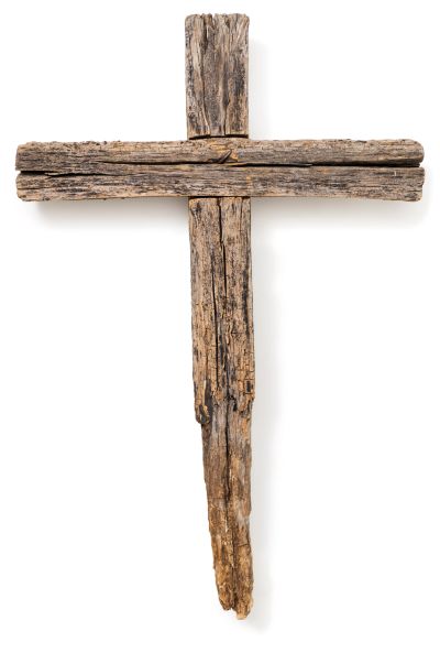 Rustic wooden cross made of aged planks.