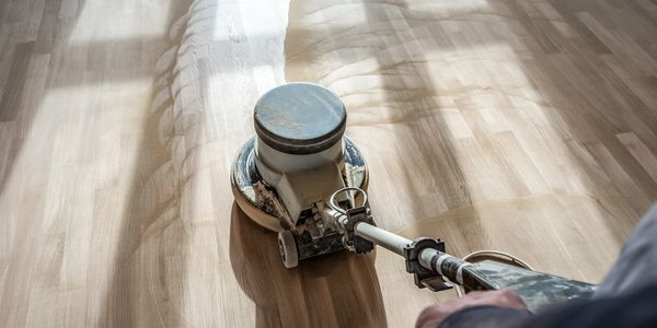 sanding hardwood floor with sander machine