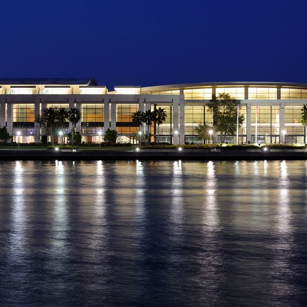 Charleston waterfront convention center at night, a key venue for corporate events.
