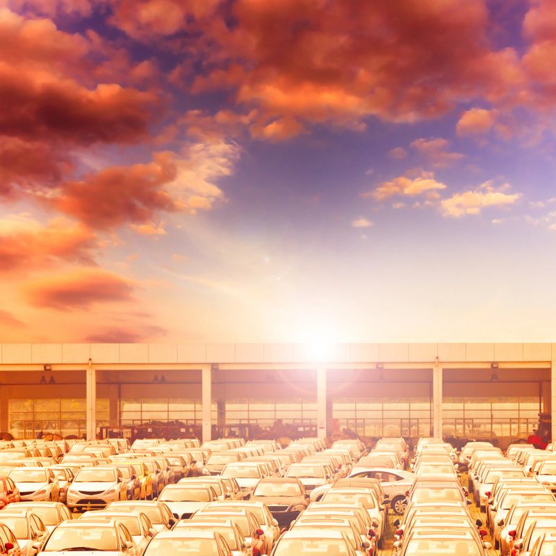 New Car Sales Lot with sun