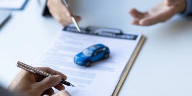 People discussing a car contract.