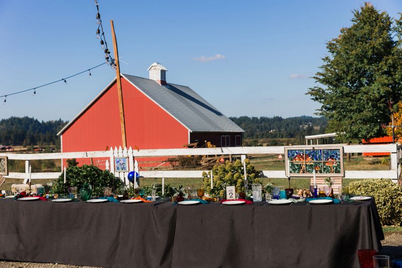 Rustic Barn wedding event tables. Very tasteful elegant table design and centerpieces.