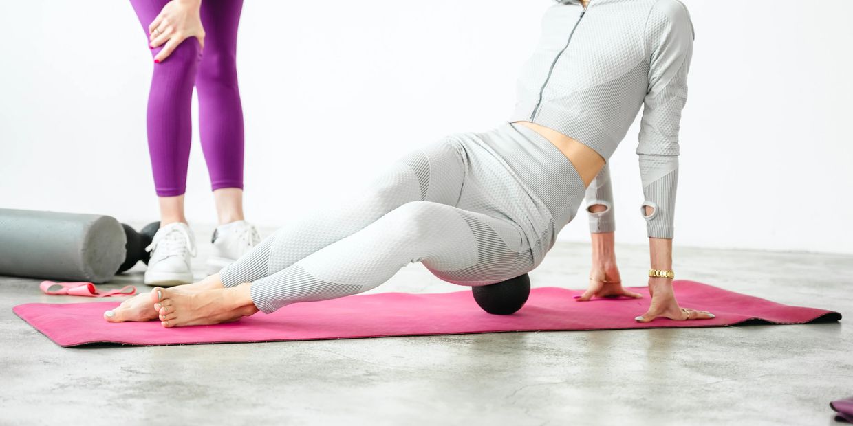 A woman doing exercise On the mat
