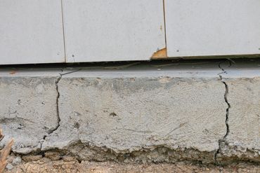 Foundation cracks near the ground