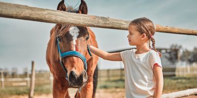 Girl and Horse after equine therapy experience at Horse & Soul Equine in Hays, Kansas