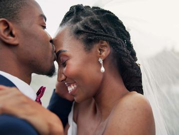 Couple sharing a tender moment on their wedding day.