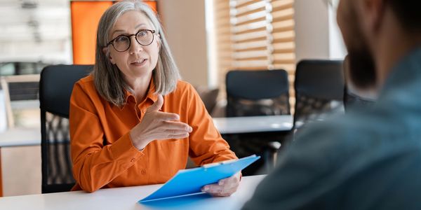 Woman providing consultation in an office.