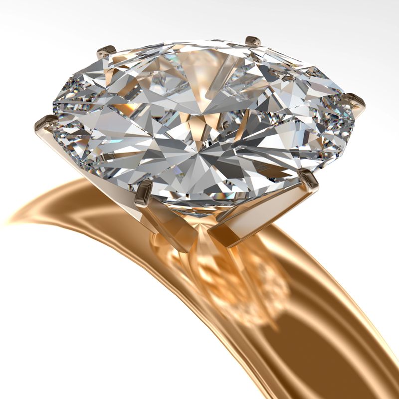 A beautiful gold diamond encrusted ring isolated on white.