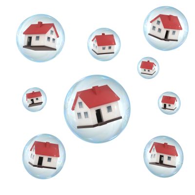 Miniature houses inside transparent bubbles.
