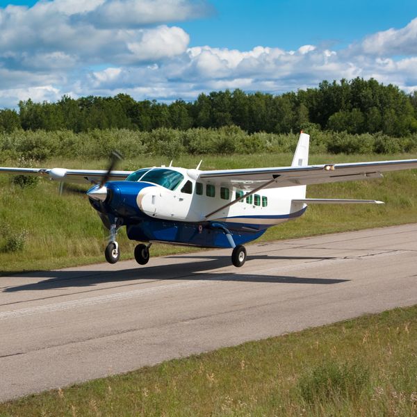 Small propeller driven cargo aircraft landing