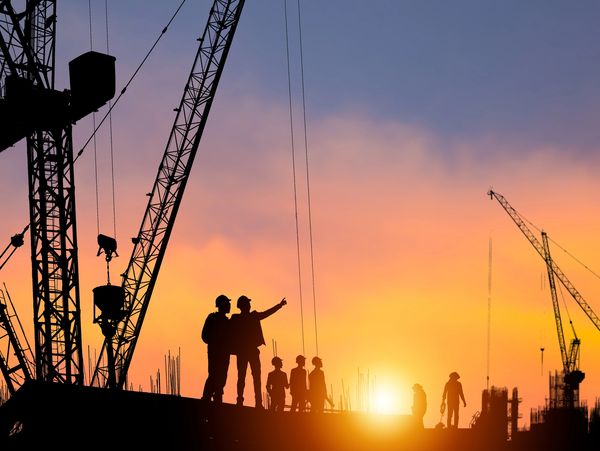 Contractor discussing a project, with an Active Enterprises construction supplier representative.