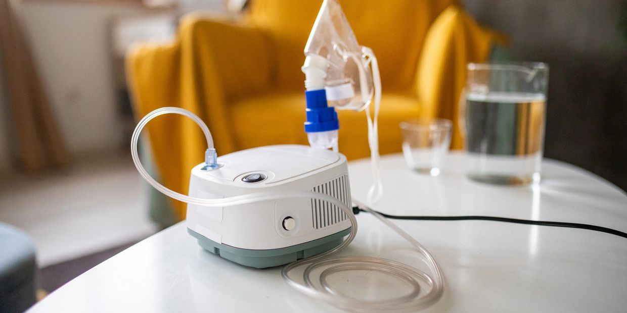Nebulizer Machine with mask on table.