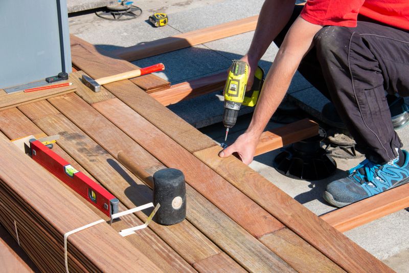 Craftsman working on a residential deck installation