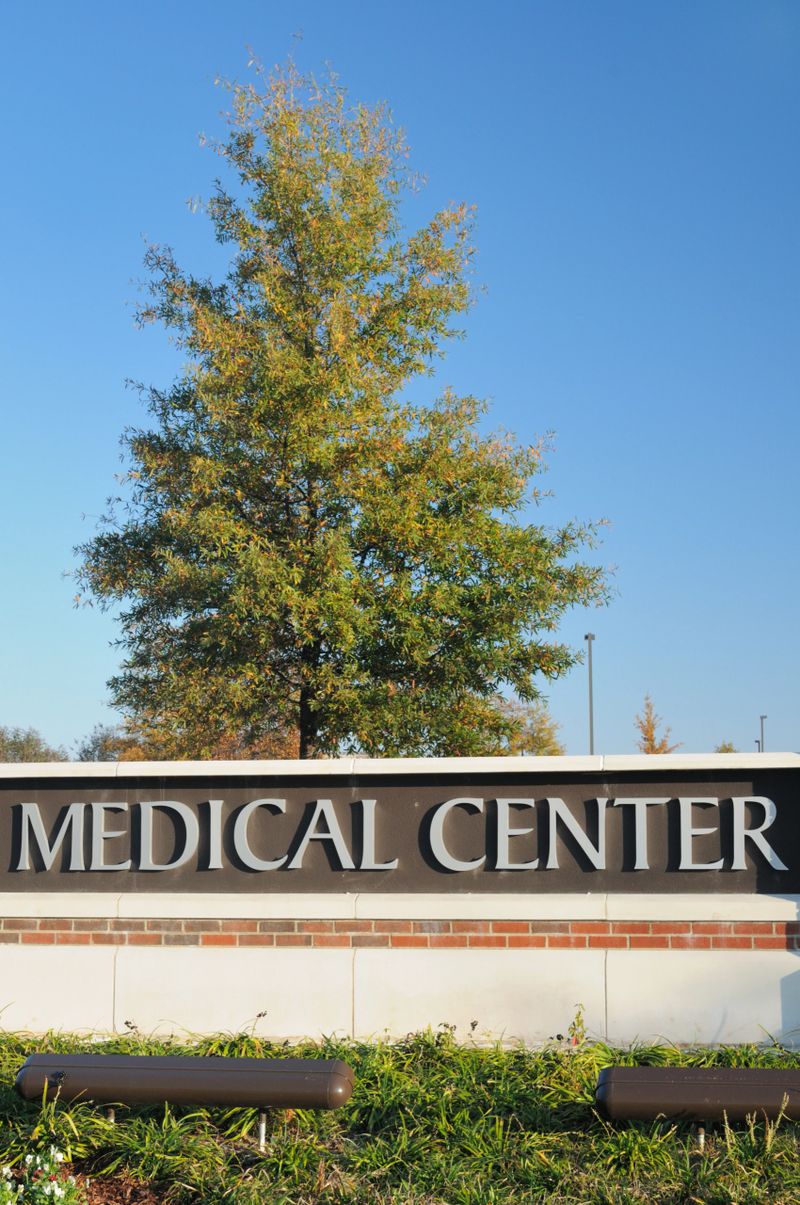 Sign for medical center with tree and copy space