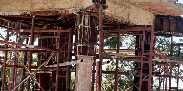 Concrete structure under construction with metal reinforcements.