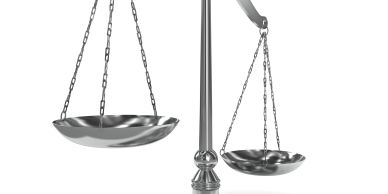 A metallic balance scale with two pans.