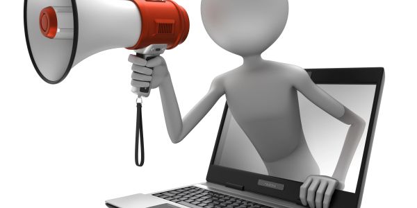 3D figure with megaphone emerging from laptop screen.