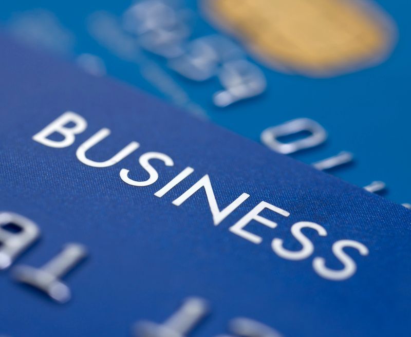 "Close up image of company Credit/charge cards.Very shallow depth of field, focus is on the word business."