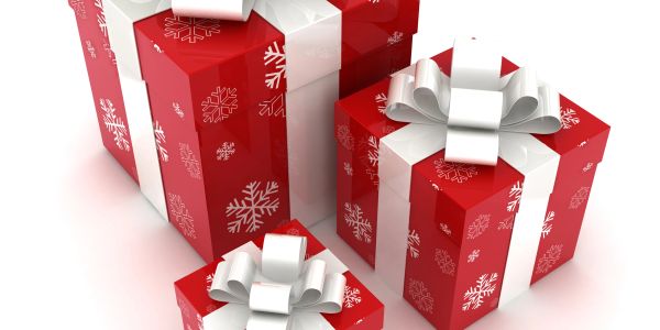 Red gift boxes with white snowflake patterns and white ribbons.