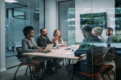 Business meeting in a boardroom discussing a complex commercial case