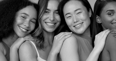 Group of women with fresh flowing skins, smiling and feeling happy. 