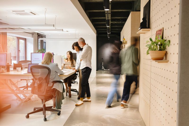 Group of colleagues working on projects in the modern office