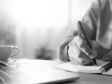 Person writing in a notebook