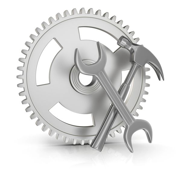 Metal gear, wrench, and hammer symbolizing tools and mechanics.