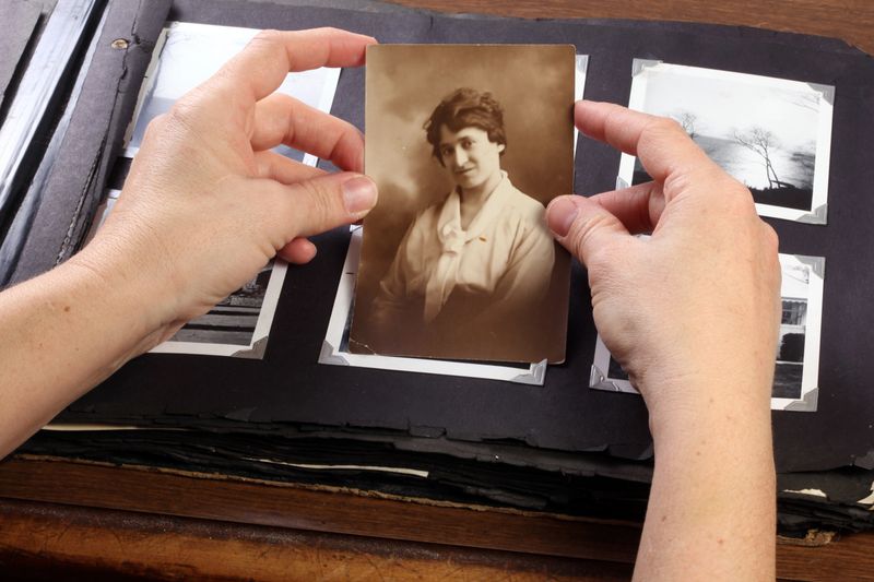 Hands holding a photo of my grandmother.