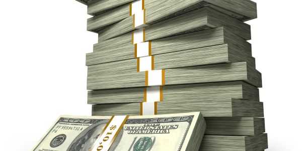 Stacks of bundled US $100 bills piled high.