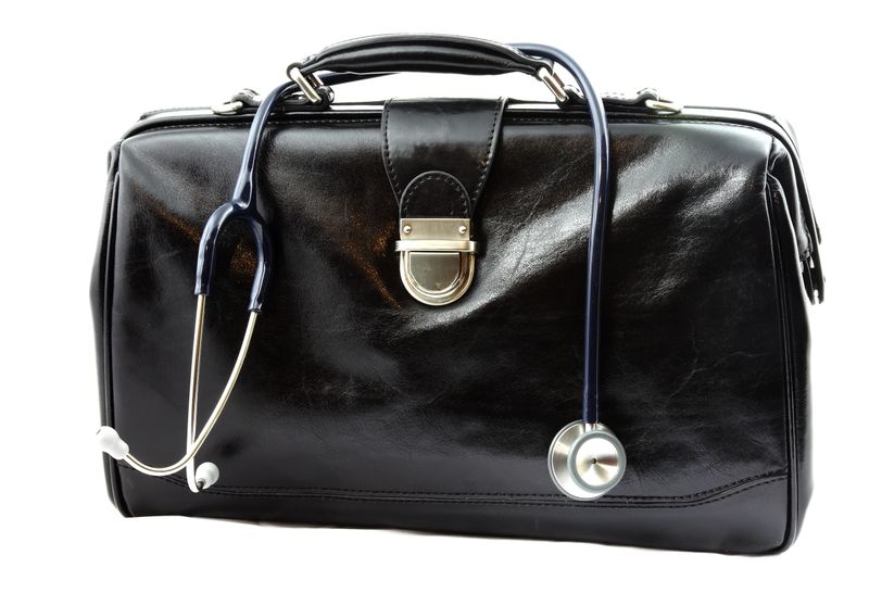 Doctor's bag with stethoscope isolated on white background.