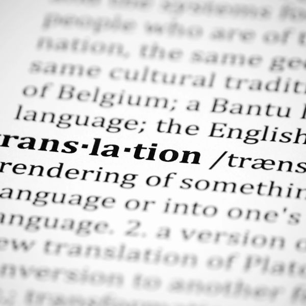 Close-up of a dictionary page showing the word 'translation' and its definition.