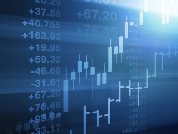 Digital stock market chart with rising candlestick graph and numbers.