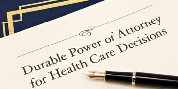 Legal document titled Durable Power of Attorney for Health Care Decisions with a fountain pen.