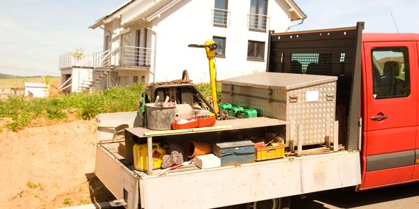 Vehicle containing tools for roofing and siding services in Central Jersey.