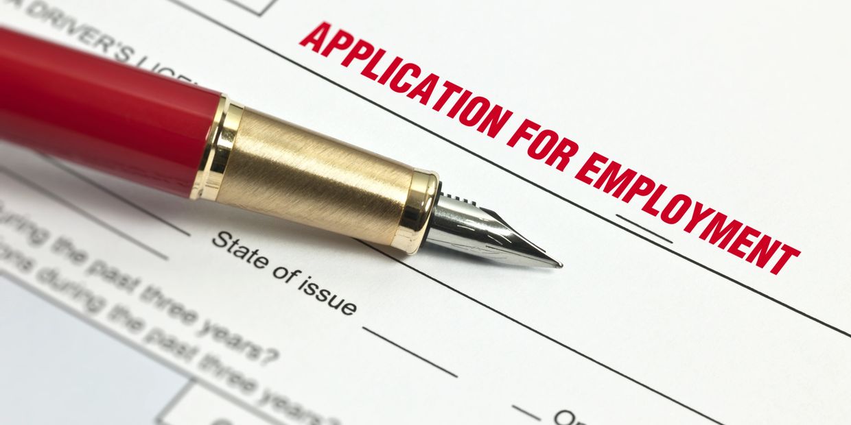 Close-up of a pen on an application for employment form.