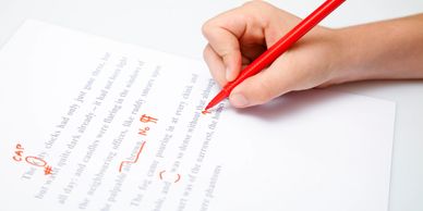 A document being edited with a red pen.