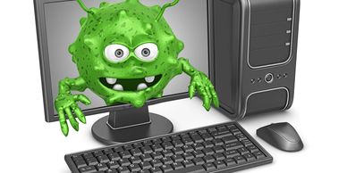 A cartoon green virus monster emerging from a computer screen.