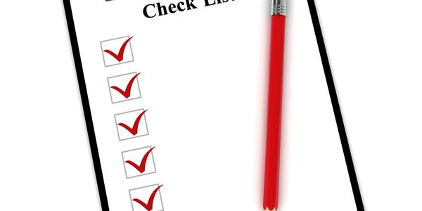 Checklist with all items checked and a red pencil.